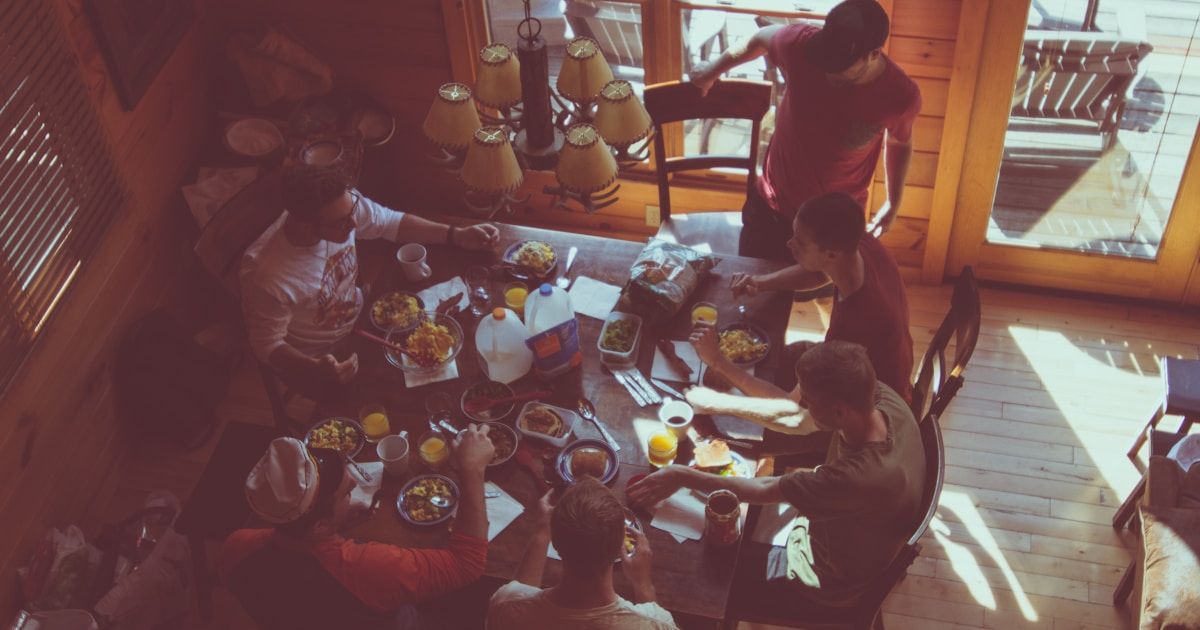 An annual multi-family block party setting up tables